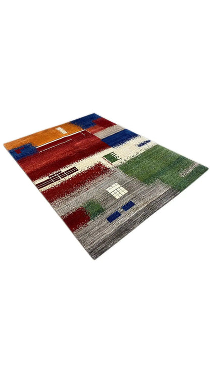 Gabbeh rug (198x150 cm), shown diagonally, abstract shapes in red, green, blue, and gray