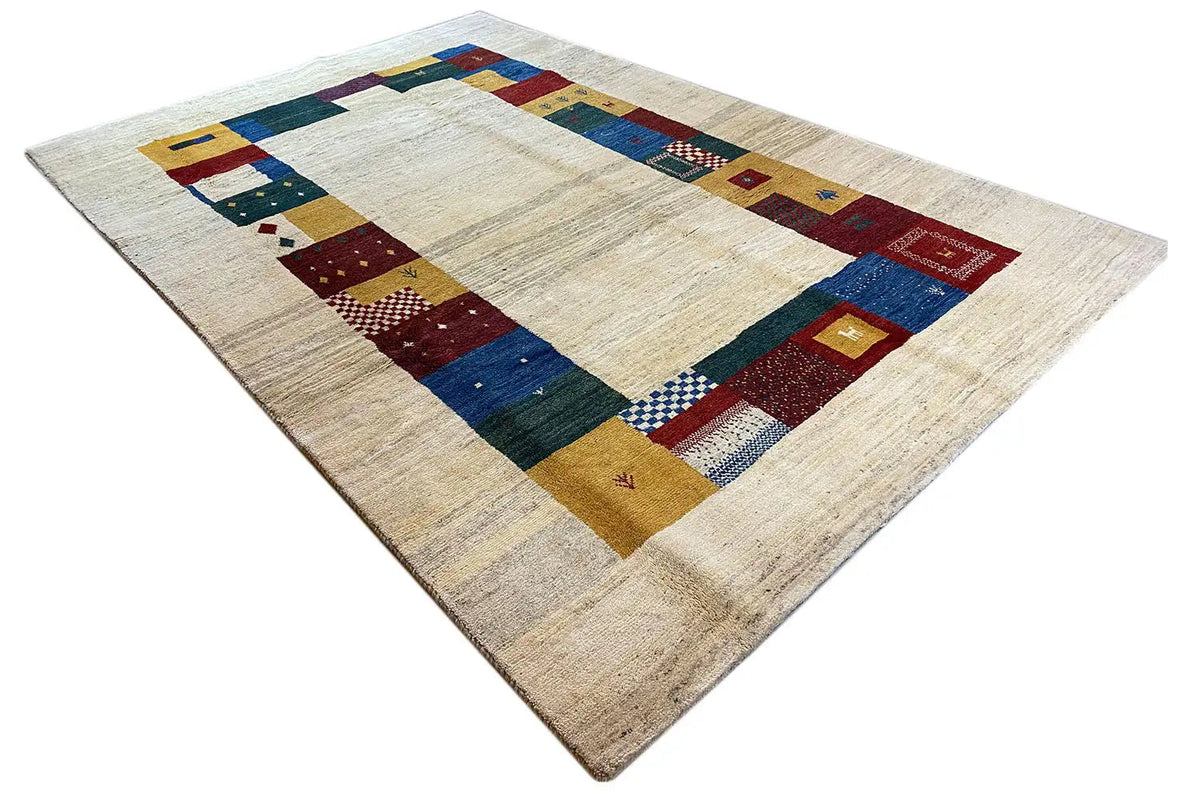Gabbeh rug 305x200 cm, angled: cream base with blue, red, and yellow border blocks