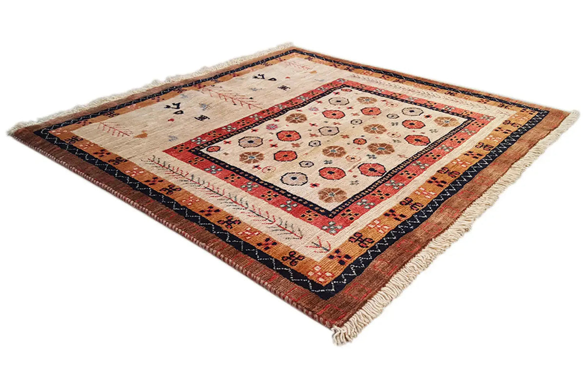 Rug at a three-quarter angle with a geometric pattern, colorful border details, and fringes