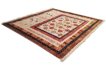 Rug at a three-quarter angle with a geometric pattern, colorful border details, and fringes