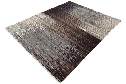 Kilim Qashqai rug with speckled stripes in brown and gray, visible fringes along the edge