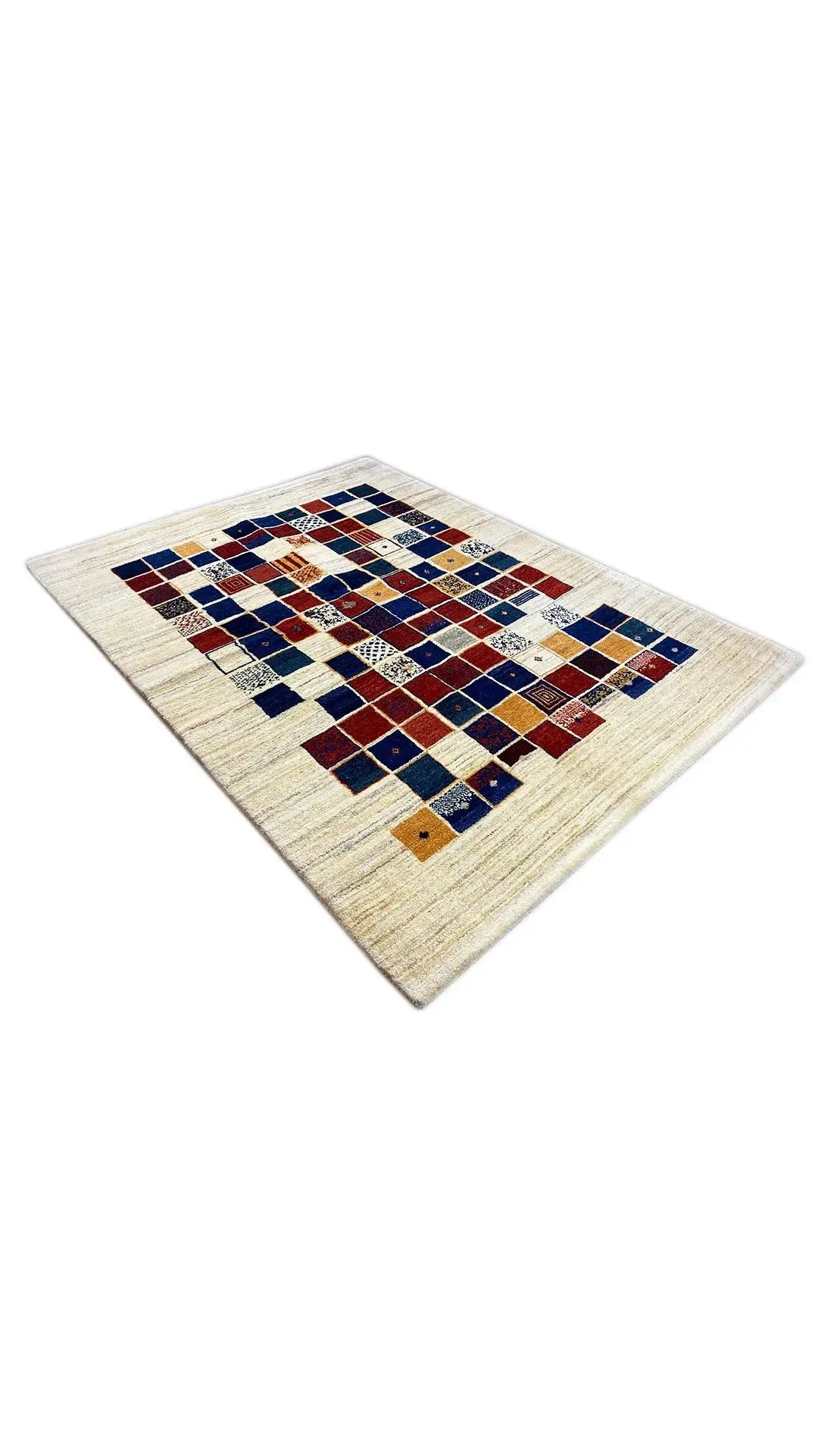 Gabbeh rug shown at an angle with a square pattern in blue, red, and cream