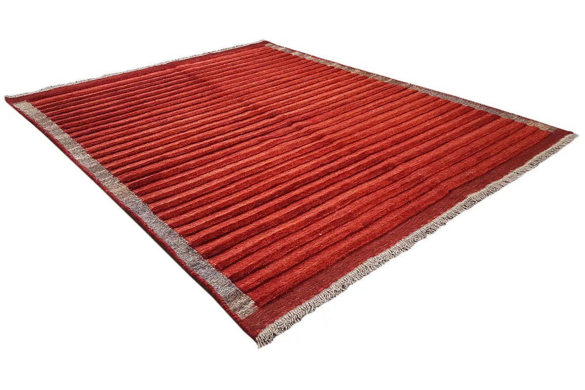 Carpet in reddish brown, laid diagonally with a gray border and stripes
