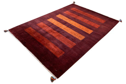 Dark red Gabbeh rug with several orange stripes and white edges