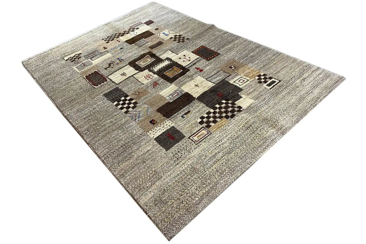 Gabbeh rug, light gray heathered with a central arrangement of geometric color fields