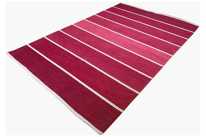 Red carpet with light horizontal stripes, corner view