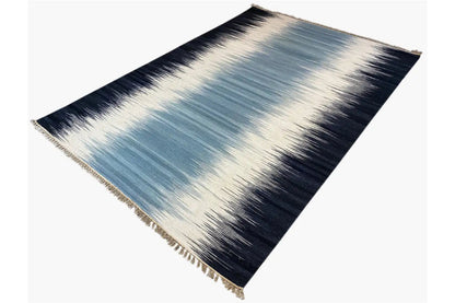 Kelim rug 160x230 cm with a medium blue center, dark borders and fringes