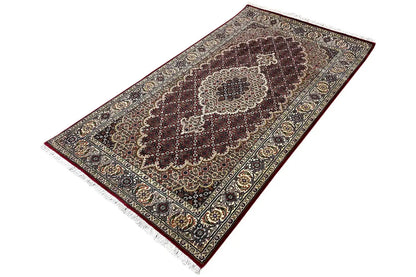Indo-Tabriz rug: elongated design with a rotated medallion rug pattern