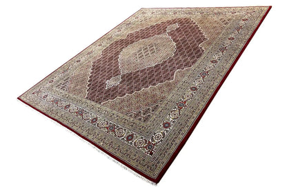 Rug with medallion and ornaments in brown and cream, diagonal view