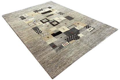 Gabbeh rug 244x173 cm with clear block patterns in beige, gray, and black