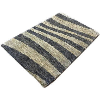 Striped rug in blue-gray and beige, diagonal stripe pattern, low pile