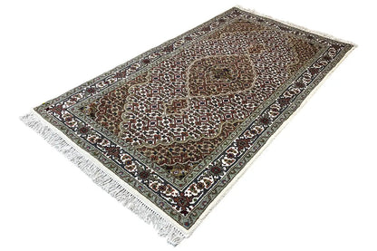 Tabriz rug, rectangular, fine ornamental pattern with a border, visible fringes