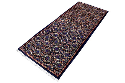 Moud rug diagonal, detailed ornamental pattern in blue, brown, and rust red