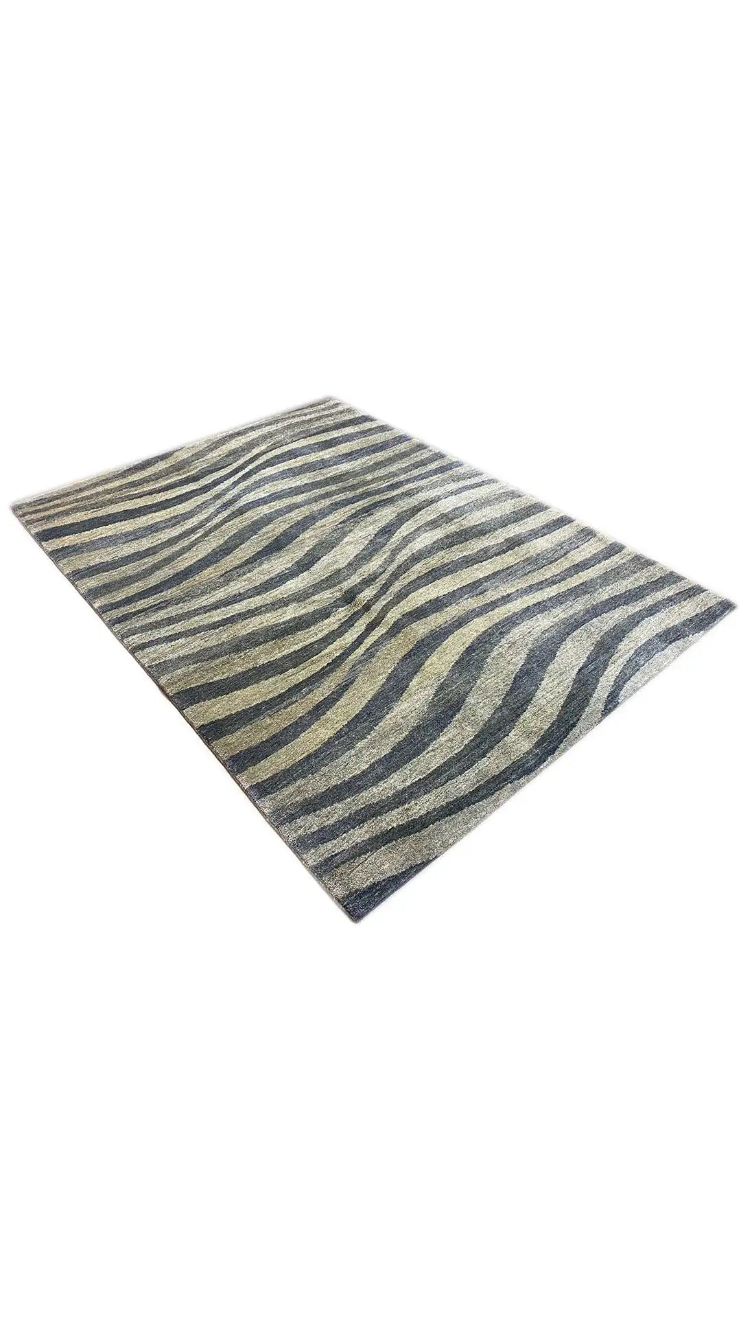 Gabbeh rug from the corner: wavy stripes in blue, gray, and beige