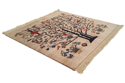 Beige rug with tree ornaments and colorful floral motifs, fringed edge.