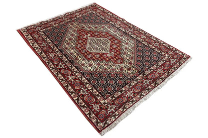 Hamadan rug with a red border, dark blue pattern, and centered medallion