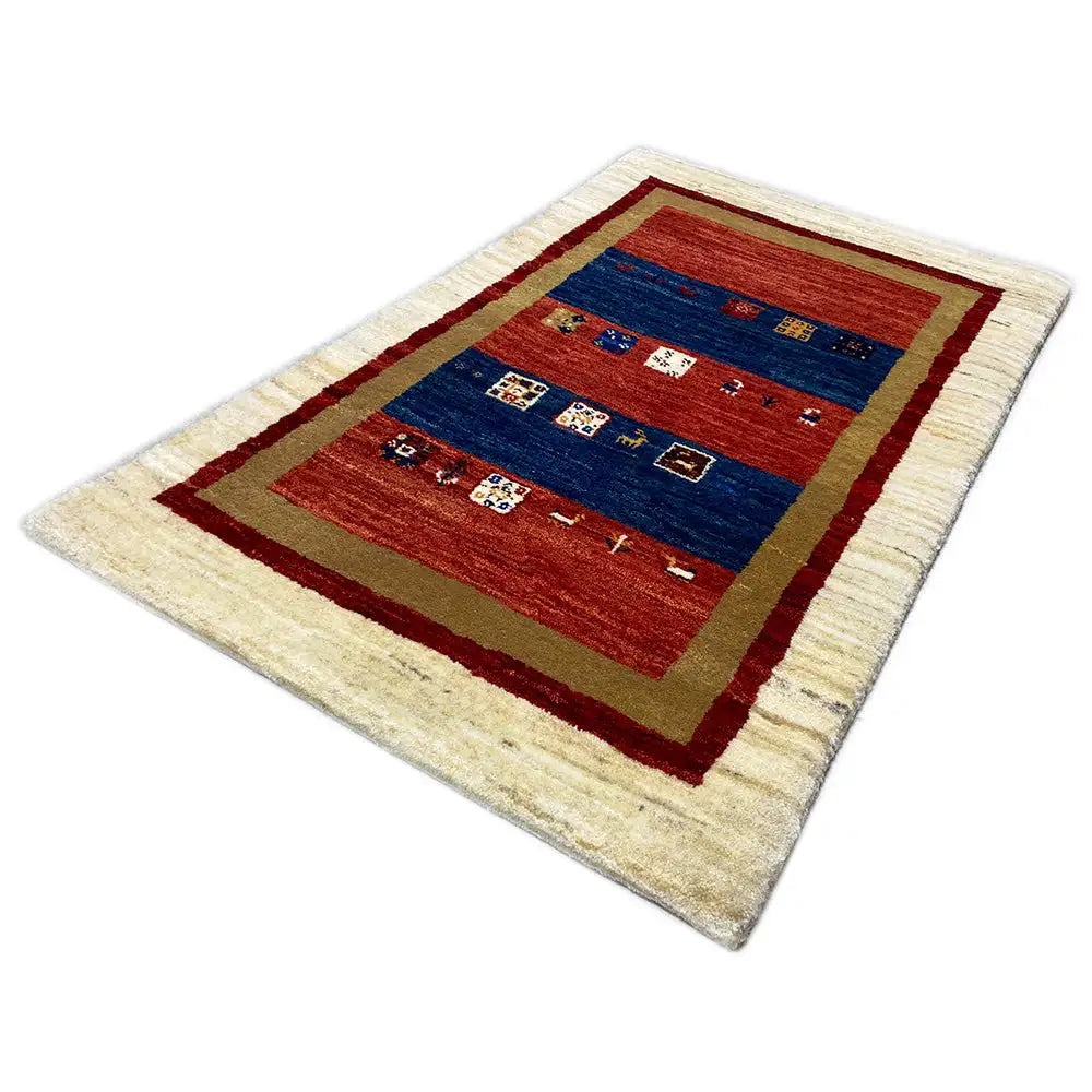 Gabbeh rug laid flat: cream-colored border, red and blue striped pattern