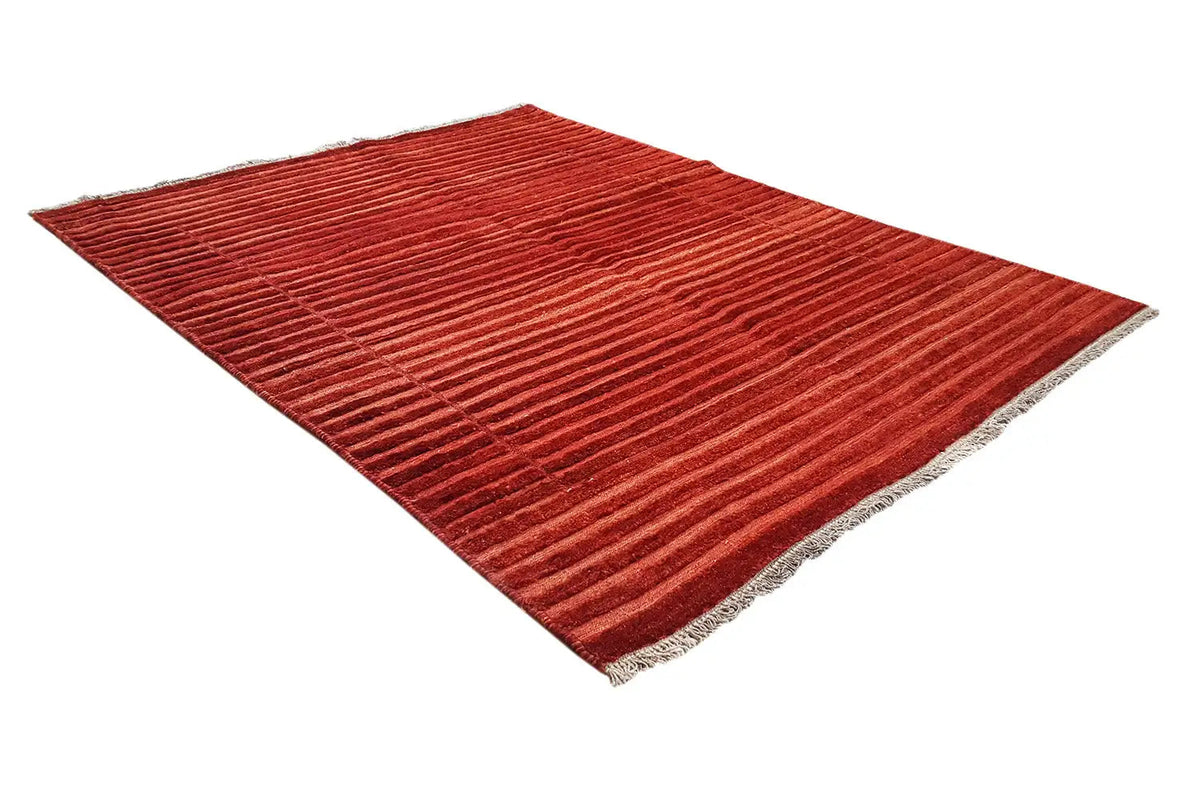 Reddish-brown rug with a linear texture and narrow fringes along the edge