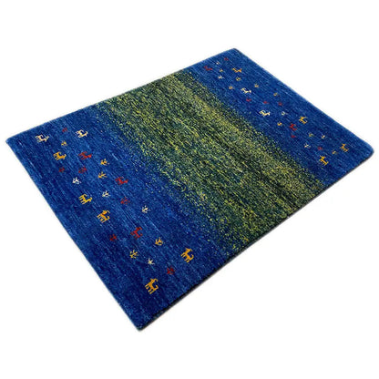 Gabbeh rug with diagonal blue-green stripes and colorful animal motifs