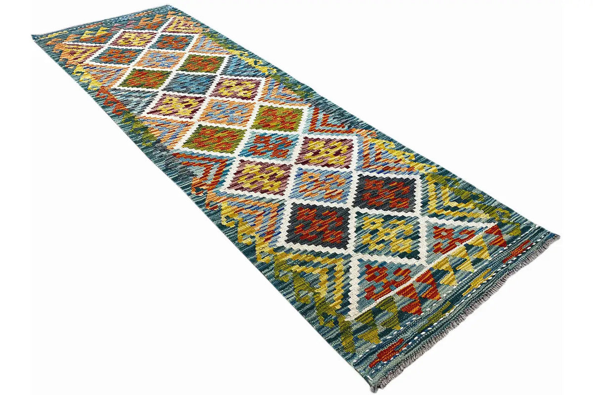 Afghan kilim runner with zigzag and diamond pattern, braided edges, multicolored