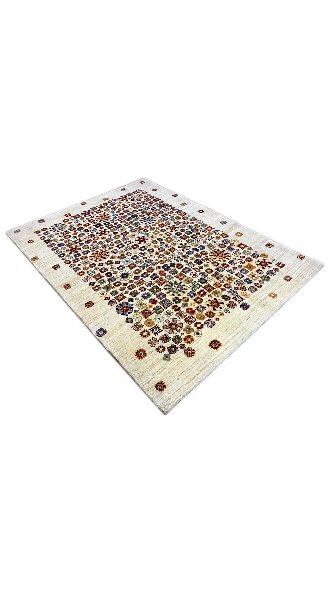 Rug viewed from above with a colorful, circular ornamental pattern on a cream background