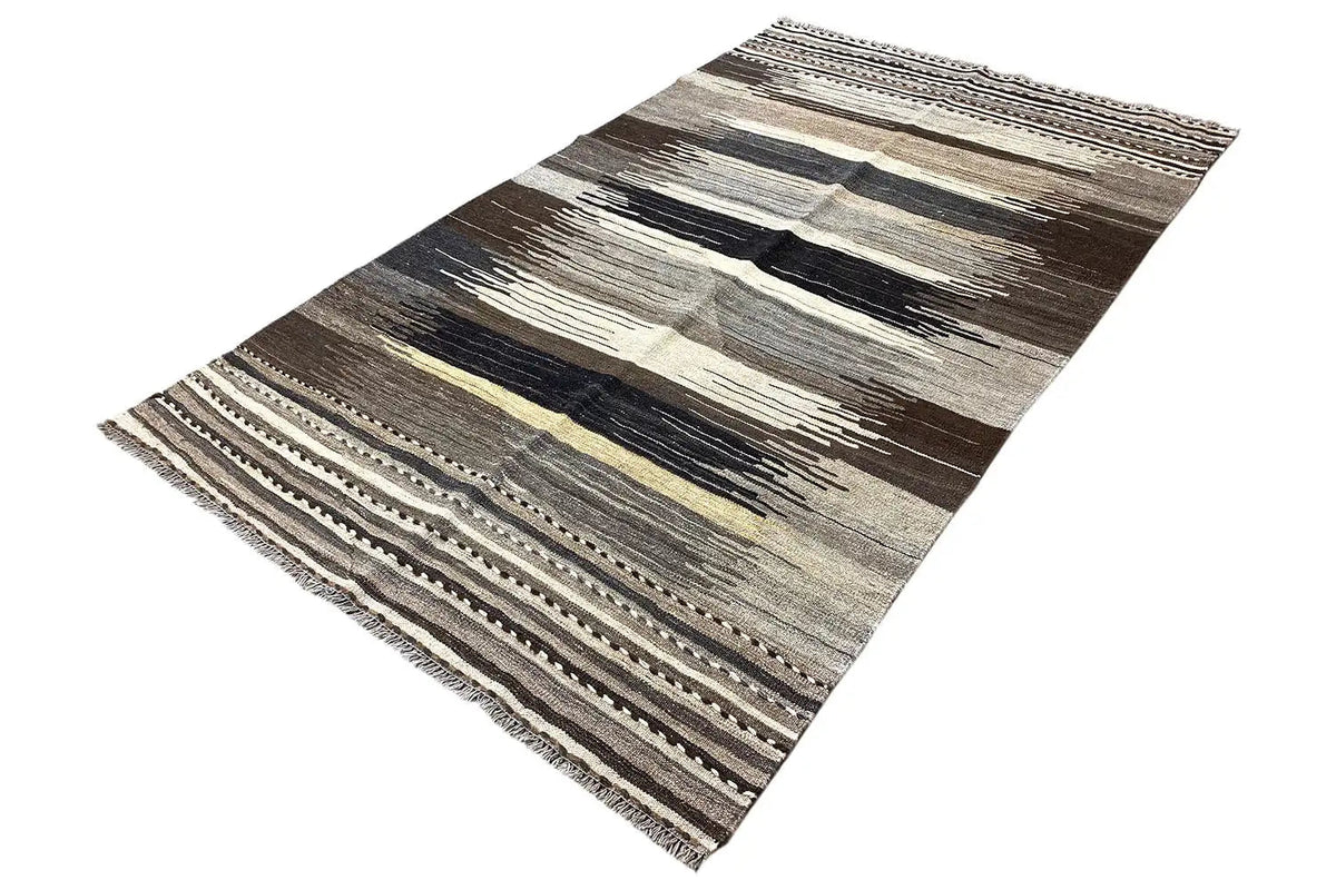 Kilim rug with a striped pattern in black, gray, beige, and ochre, slightly diagonal