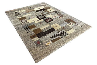 Rectangular Gabbeh rug with patchwork squares, diamonds, and decorative lines in beige and dark brown