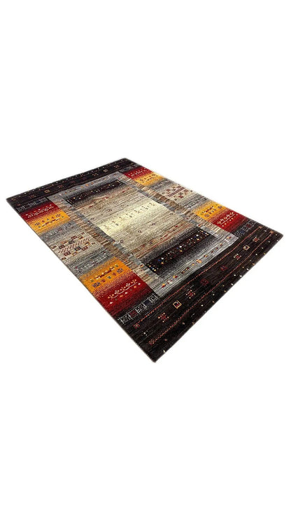 Gabbeh rug in diamond perspective: brightly striped fields on a dark background