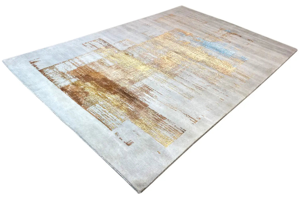 Designer rug, abstract pattern in light grey, beige and gold with a touch of blue