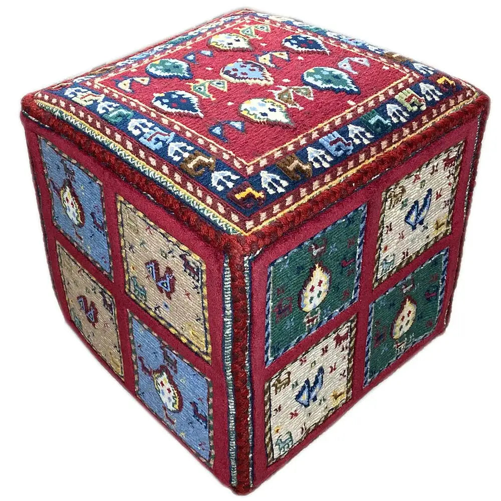 Square carpet cube with a red top, blue and green segments, and decorative border