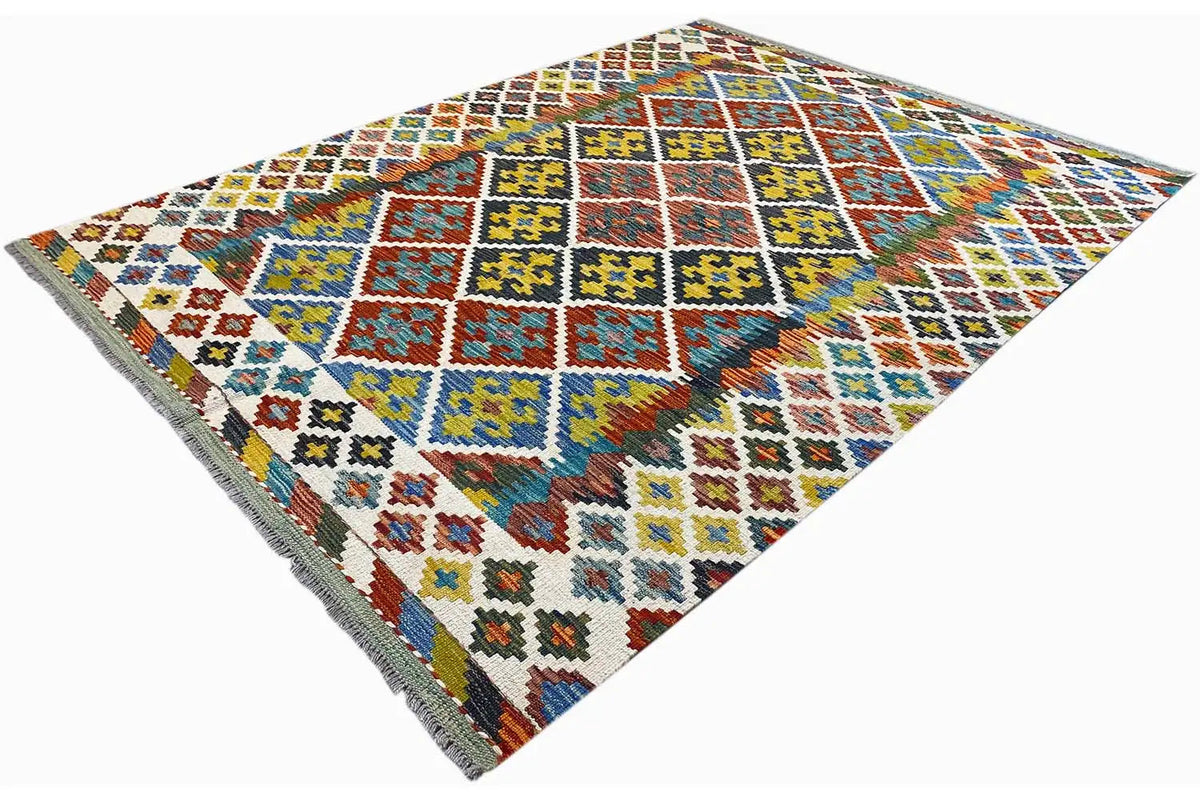 Afghan kilim at an angle, colorful squares and diamonds