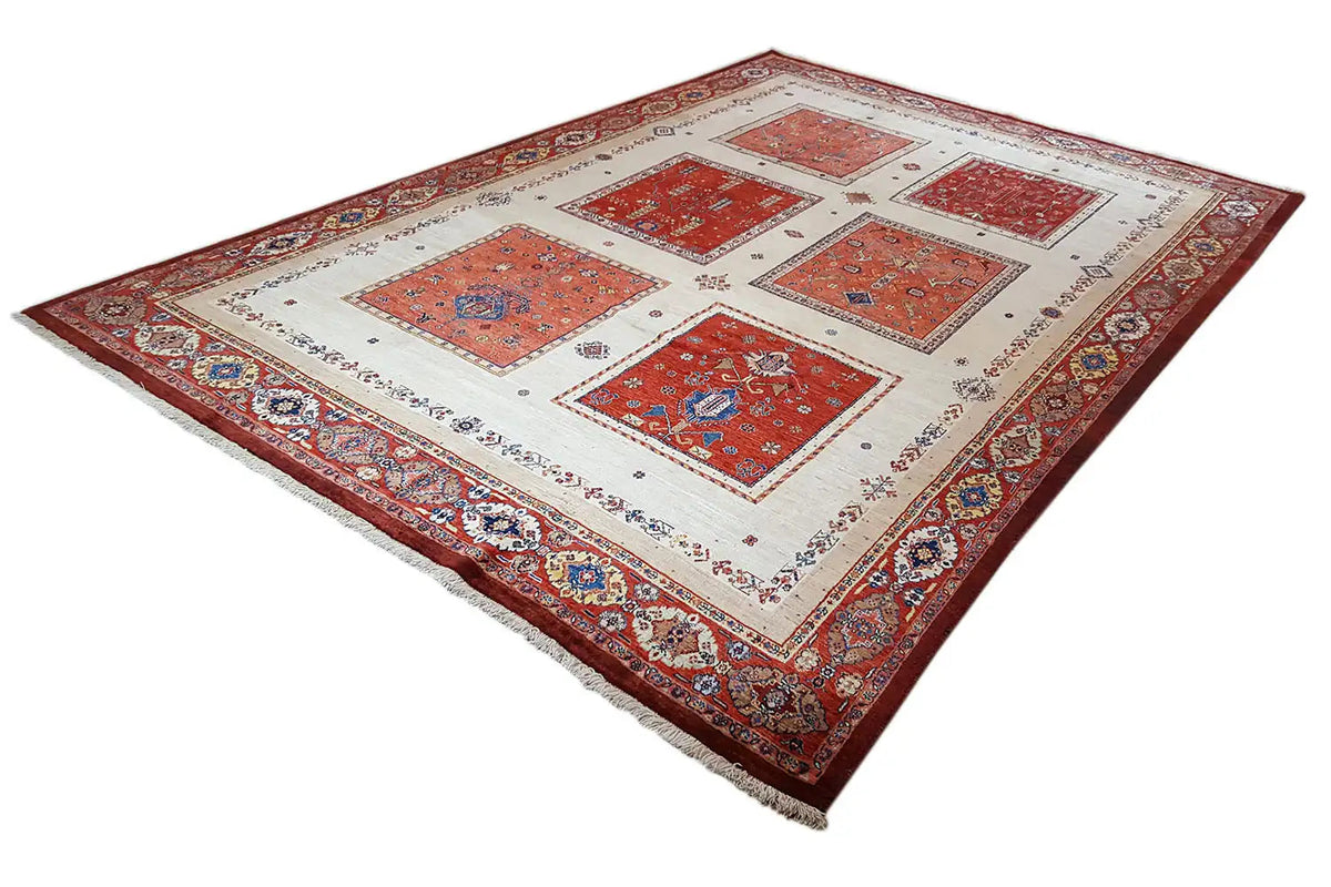 Rug in red, blue, and cream with geometric tile motifs and a finished edge