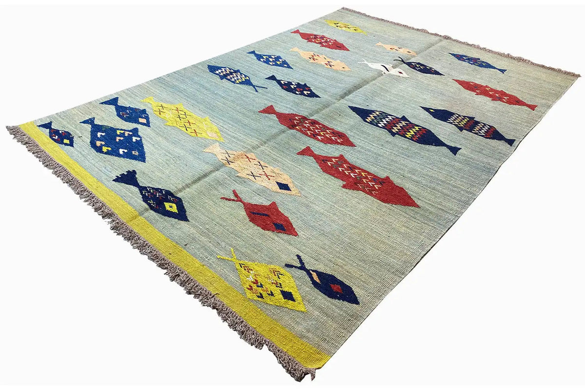 Rectangular kilim with fish motifs in blue, red, and yellow; fringes on the sides