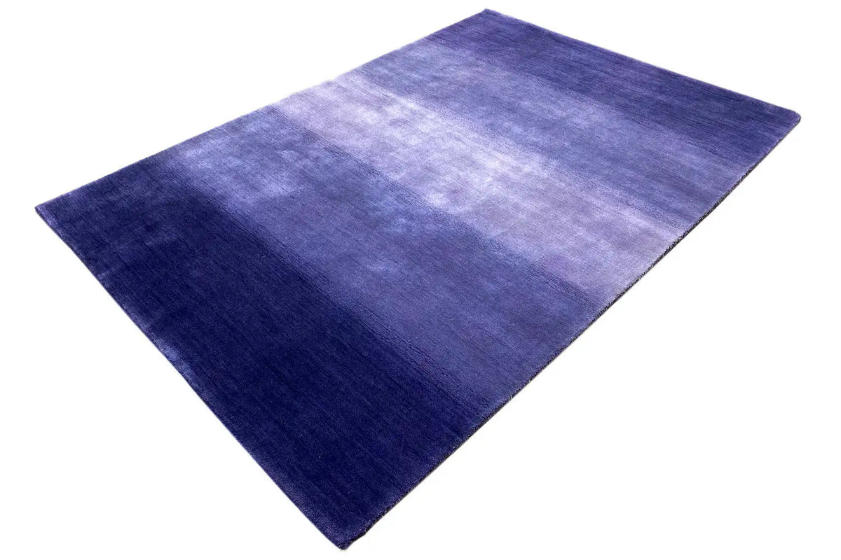 Gabbeh rug 180x123 cm, diagonal view: dark blue sections and light stripes
