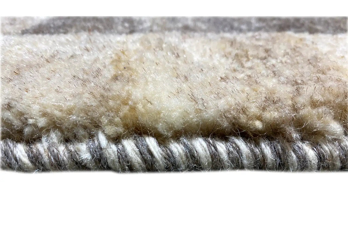 Gabbeh rug: fringed edge, beige pile with dark threads