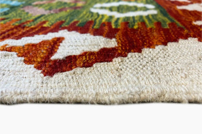 Kilim rug, detail of the weave structure and pile at the edge with multicolored patterns