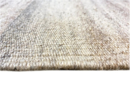 Kilim dhurrie rug, light mottled surface with fringes along the edge