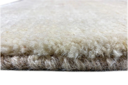 Gabbeh rug 177x84 cm, beige pile with dense border fibers, close-up view