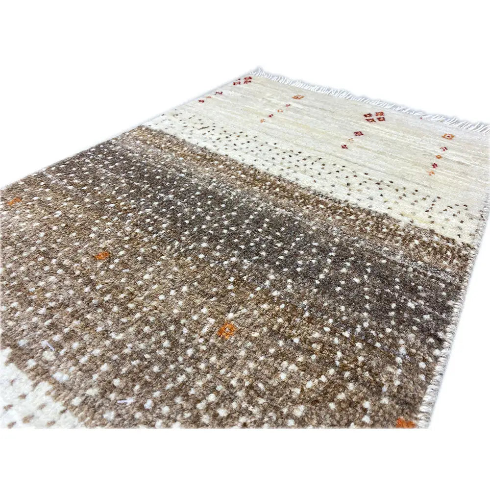 Gabbeh rug 59x41 cm close-up: mottled brown pattern with beige stripes and fringes