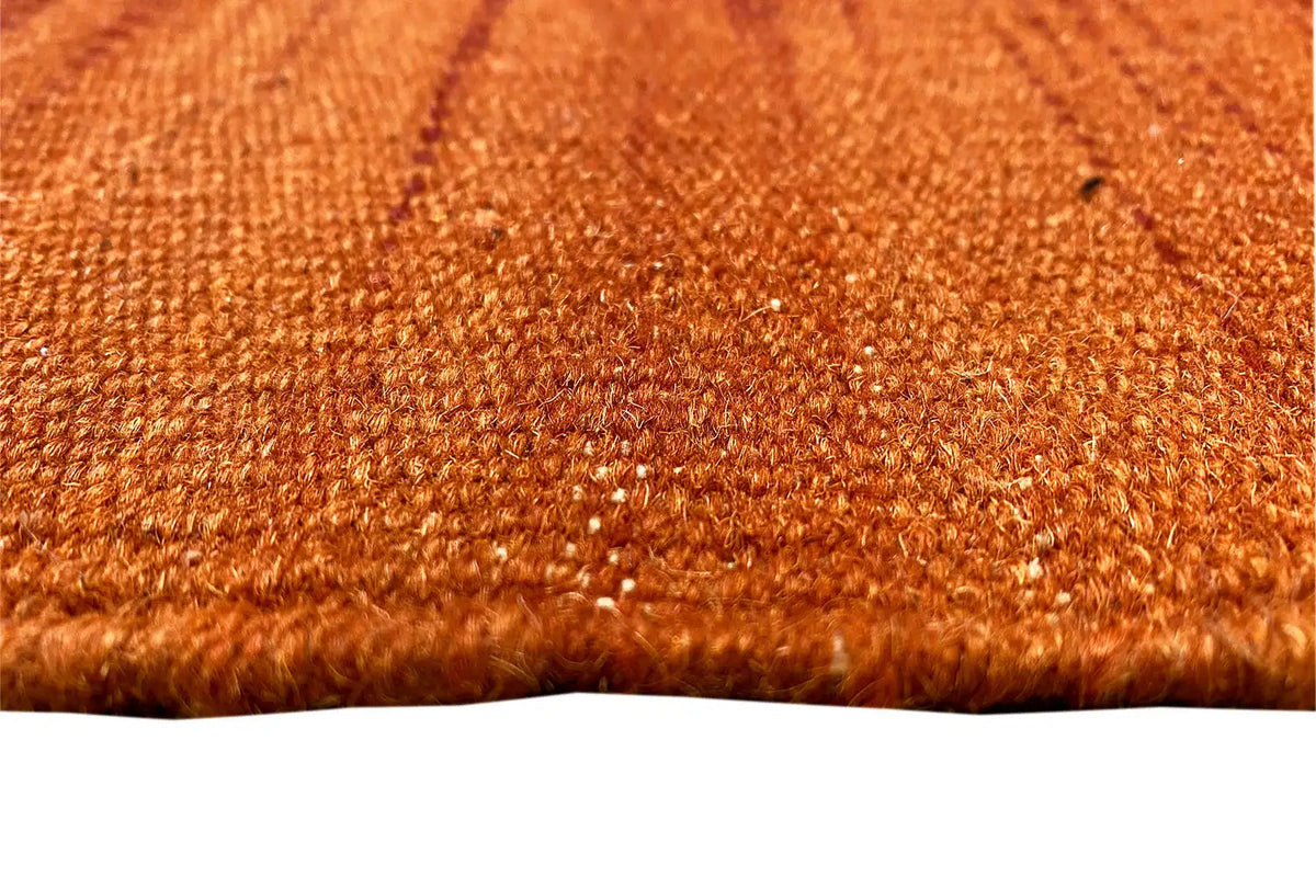 Modern kilim dhurrie rug, orange texture with a fine woven pattern, close-up