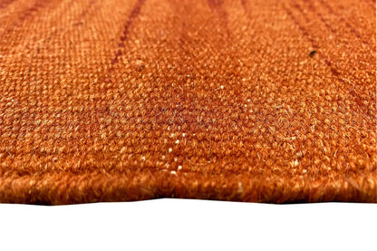 Modern kilim dhurrie rug, orange texture with a fine woven pattern, close-up