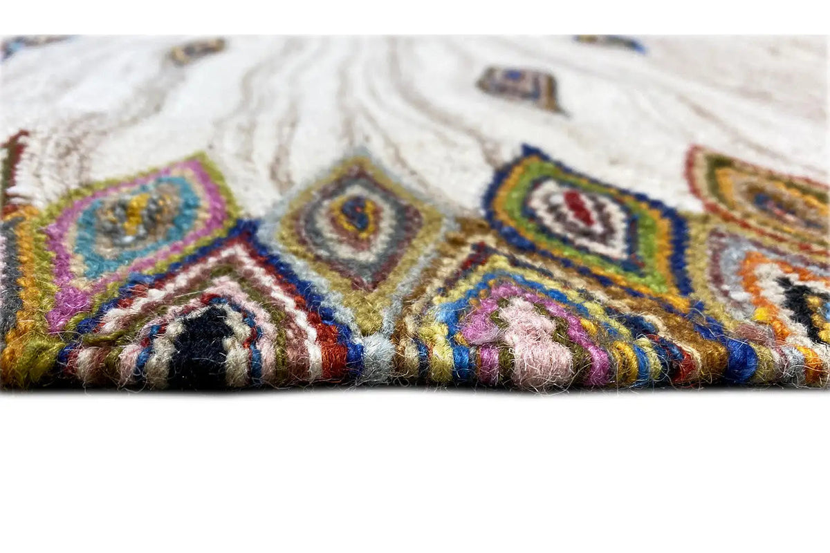 Kelim dhurrie rug detail: colorful patterns, dense pile, and colorful stitching