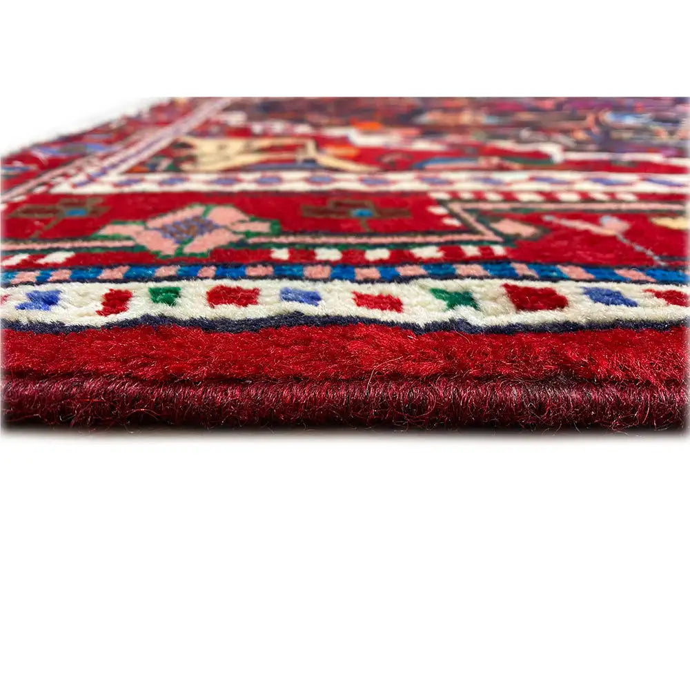 Hamadan rug with a colorful pattern and visible pile or fringe edge.