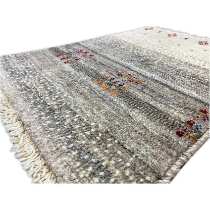 Gabbeh rug 57x41 cm, woven texture detail, mottled gray with red and multicolored patterns