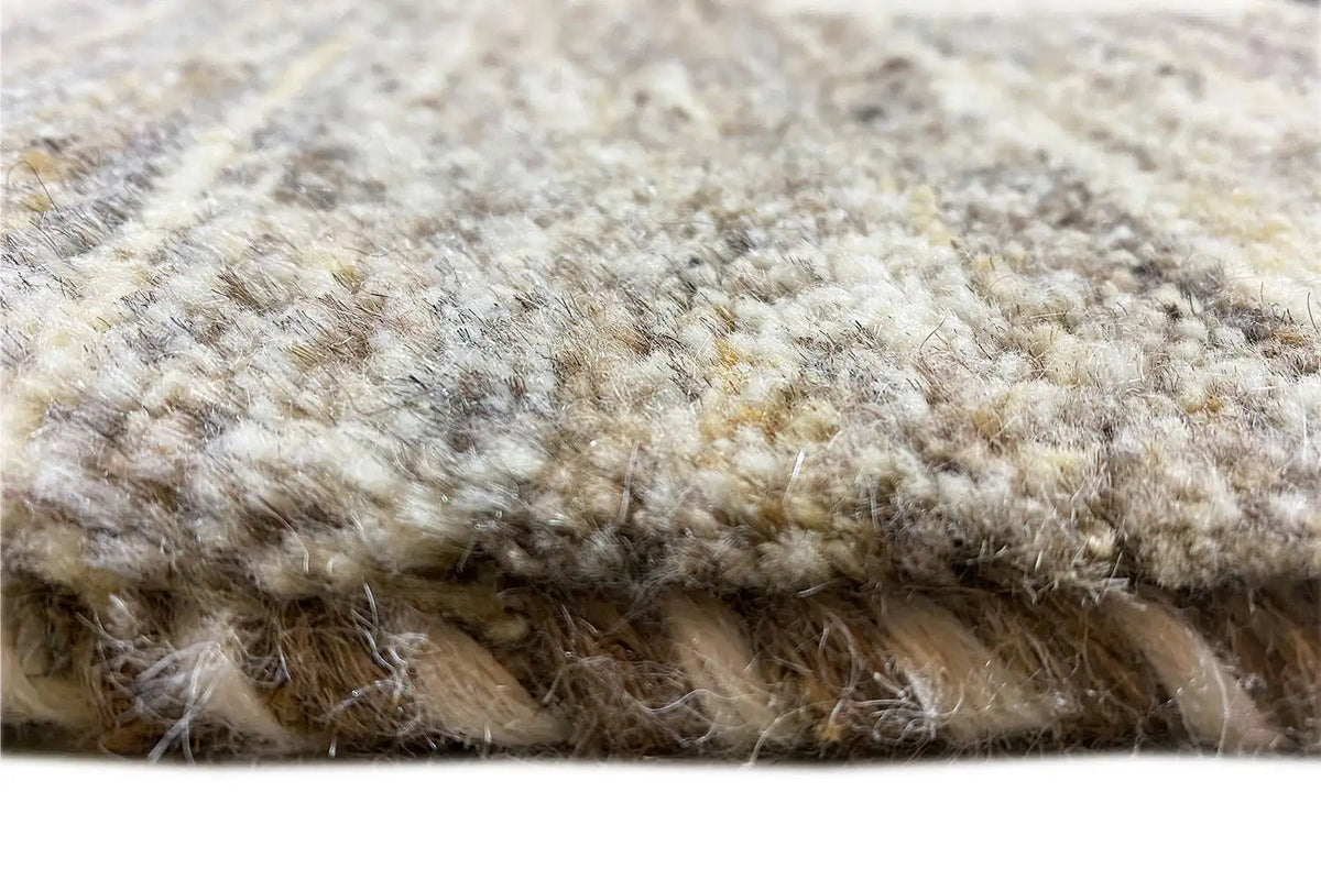 Gabbeh rug, 192x152 cm, detail of the dense beige and light gray pile surface