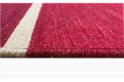 Red kilim edge with fringes and beige finishing band, woven texture