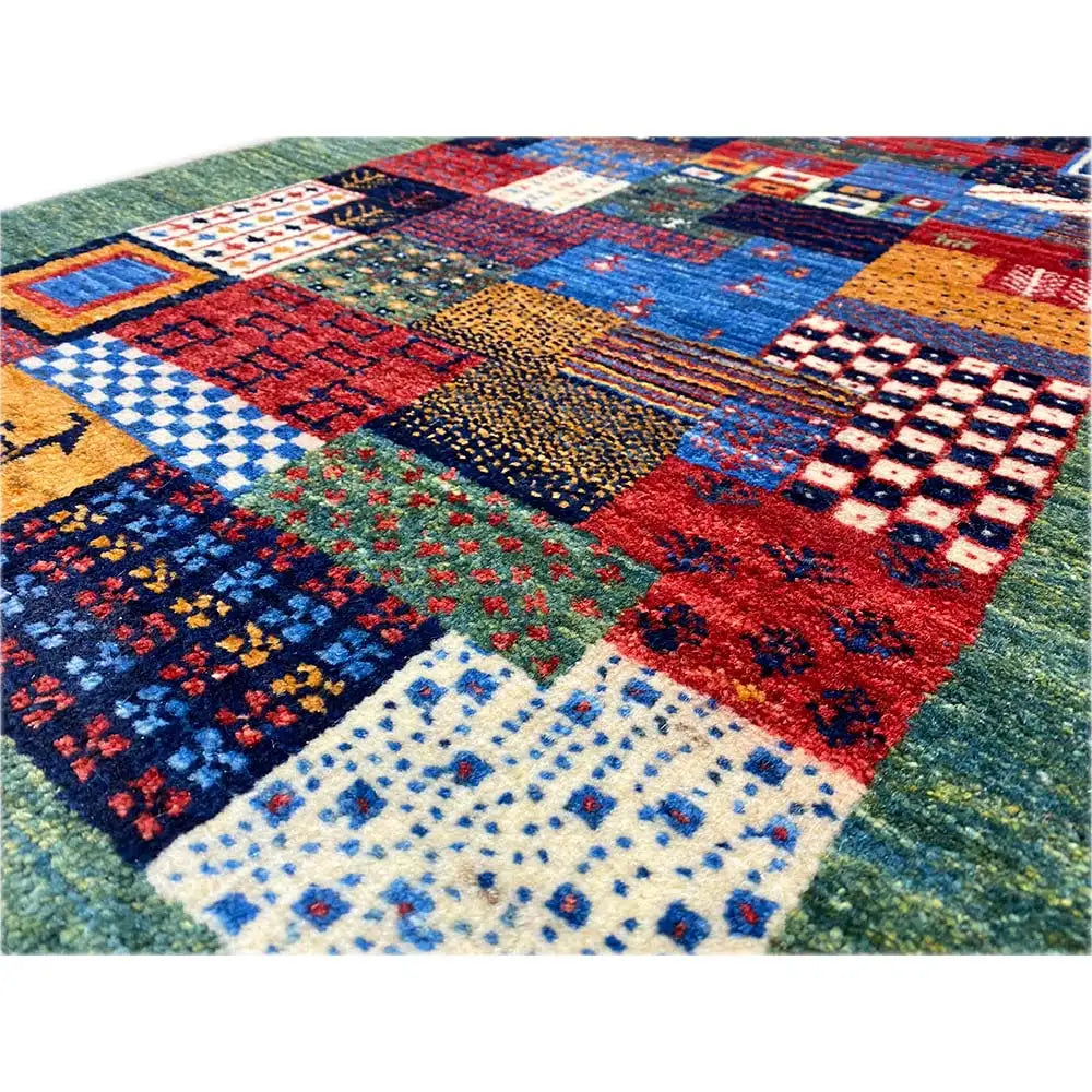Close-up Gabbeh rug 96x60 cm with colorful tile motifs in a patchwork design