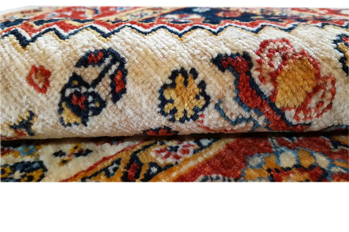 Woven runner rug with a detailed ornamental pattern and multicolored pile texture