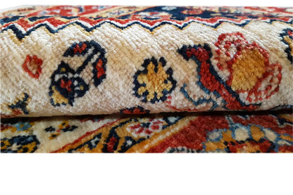 Woven runner rug with a detailed ornamental pattern and multicolored pile texture