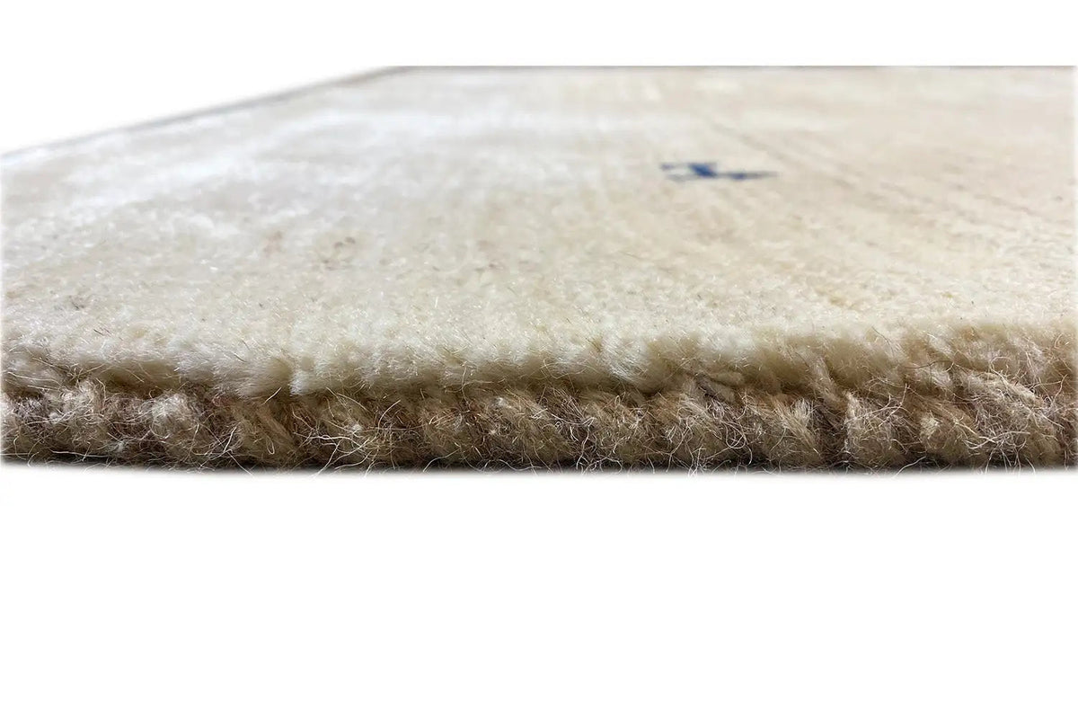 Gabbeh rug, light cream color with brown pile around the edge